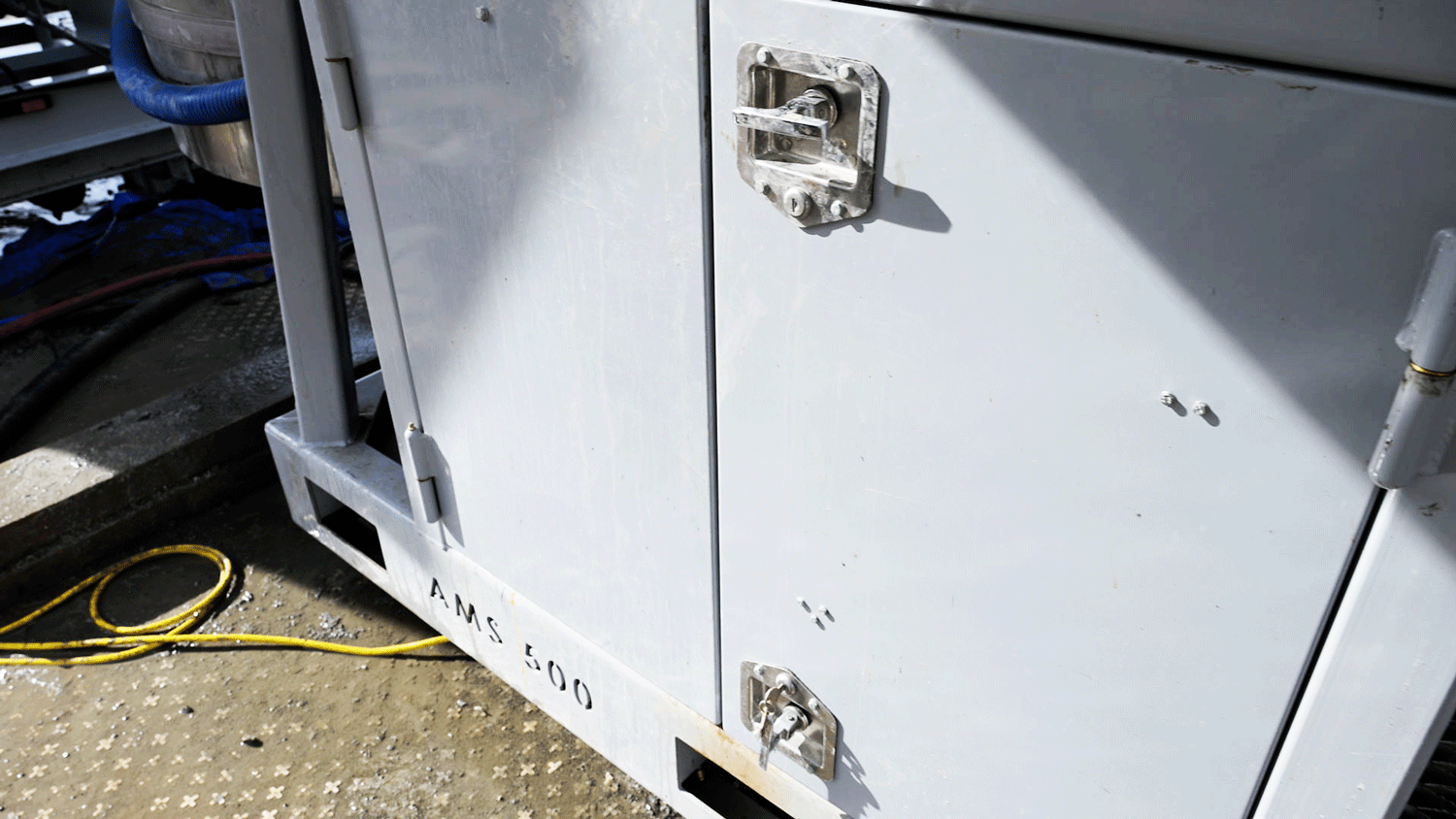 Made in the USA Intric AMS500 mixing station skid base and lockable service cabinet doors showing heavy-duty construction and forklift pockets for rent or purchase from National Piling Products