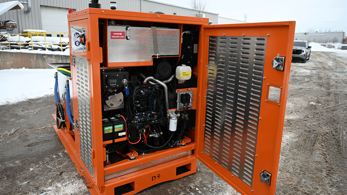 Intric D9 colloidal grout plant power pack with engine and hydraulic components exposed for service at National Piling Products yard