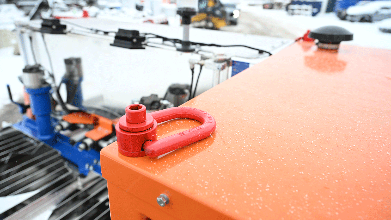 Intric D9 grout plant top deck with red lifting shackle and stainless mixing system in snowy National Piling Products yard