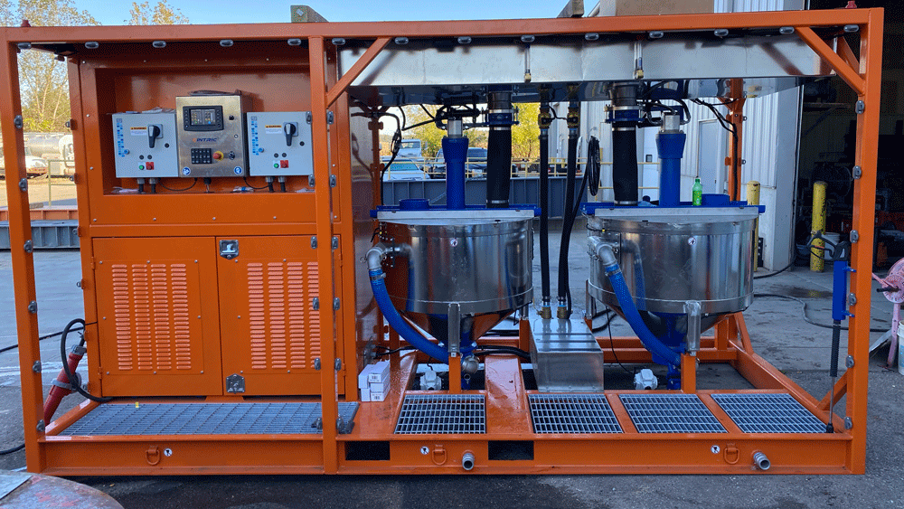 Made in the USA Intric DT650 dual-tank mixing station with control panel and stainless steel high-shear mixing tanks on orange skid, for rent or sale from National Piling Products