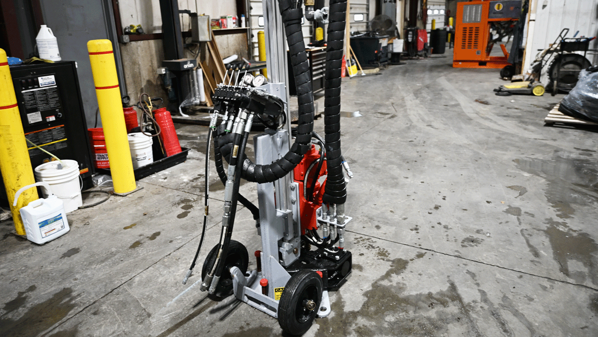 American-made TEI MP260 man-portable drilling system with TEI 260 head set up inside National Piling Products shop for limited-access micropile and anchor work